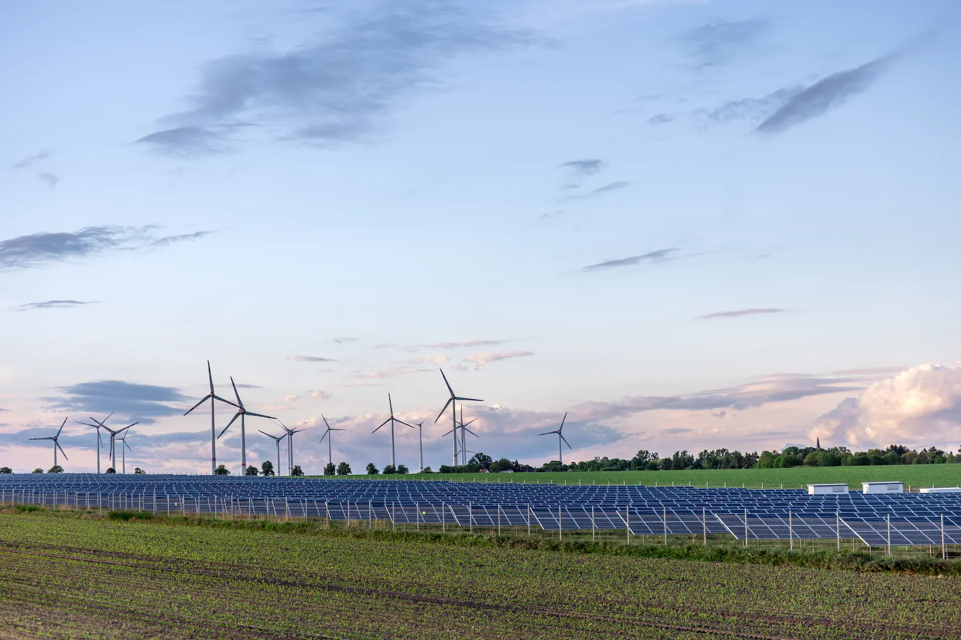 solar-panels-field-wind-turbines-horizon-renewable-green-energy
